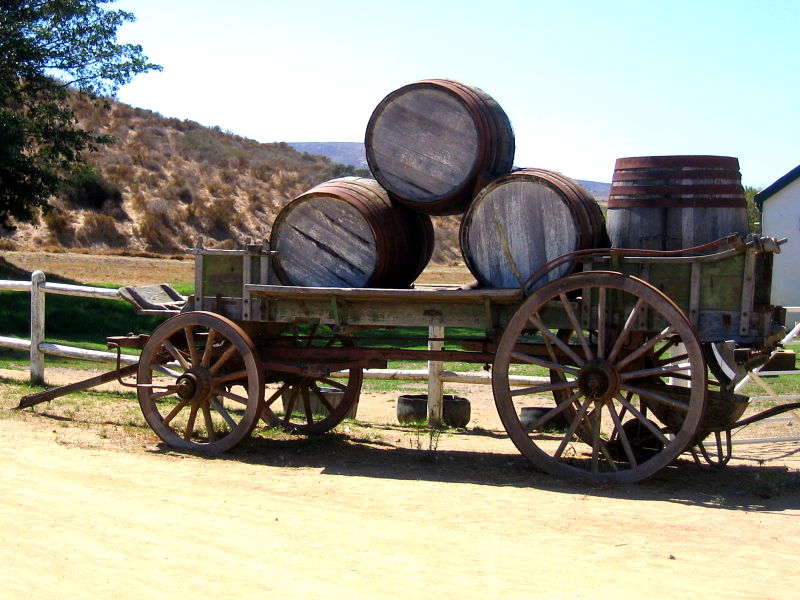 Cart and wine barrels outside Groote Post winery, Darling Hills,South Africa © Claire Ogden